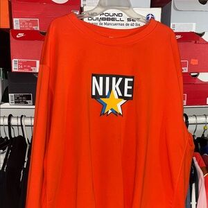 Nike Orange Sweatshirt with Blue and Yellow Star Graphic